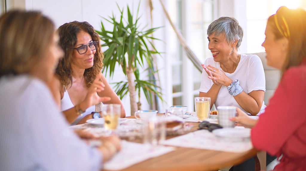 Women Sitting Around Breakfast Table Discussing Womens Health